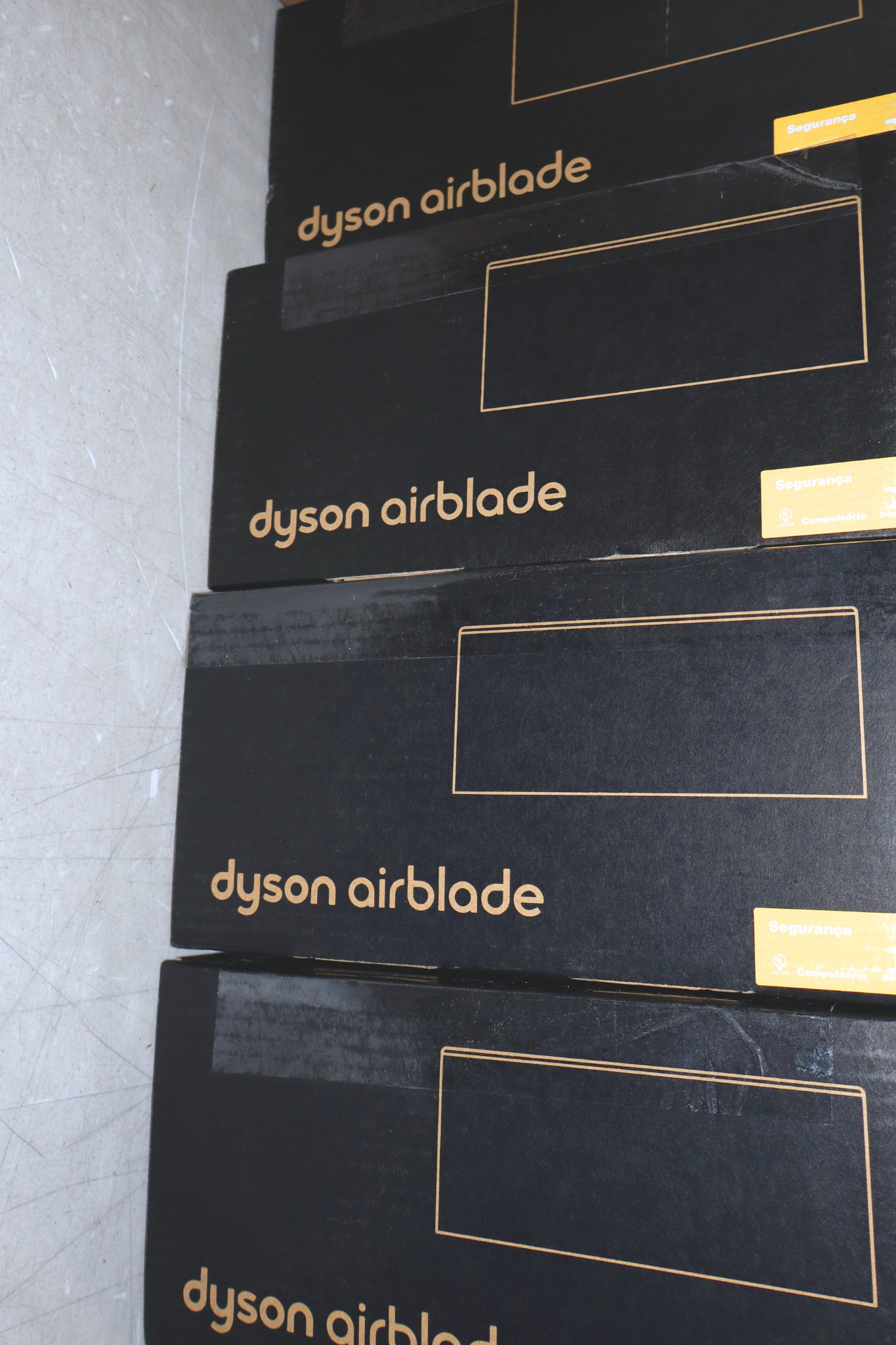 Dyson Airblade hand dryers in a commercial restroom