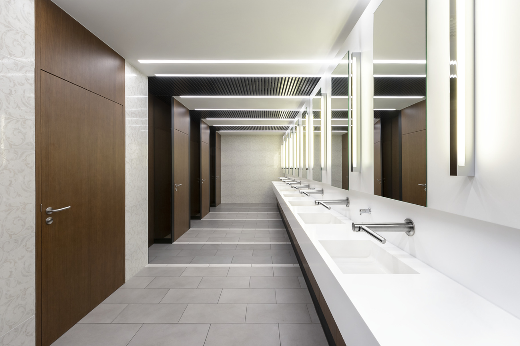 Dyson Airblade Wash+Dry faucet with integrated hand dryer at a restroom sink