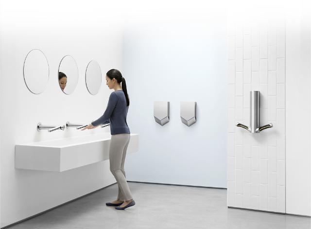 Woman using the Dyson Airblade