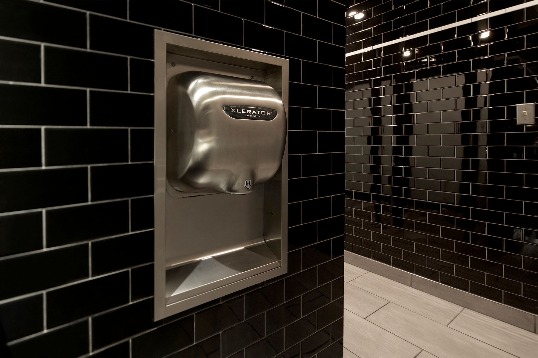 Max Burger restaurant restroom with XLERATOR recessed hand dryer